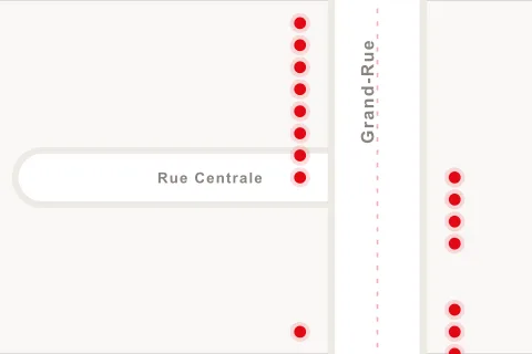 Le plan du marché, la Grand-Rue en diagonale et un jeton rouge par stand.