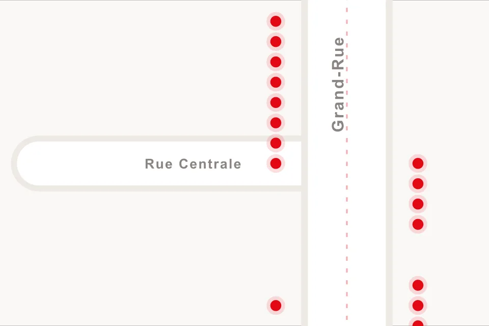Le plan du marché, la Grand-Rue en diagonale et un jeton rouge par stand.