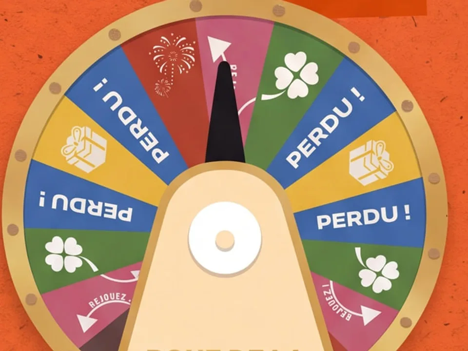 La roue de la chance du comité, ses cases colorées et sa flèche.